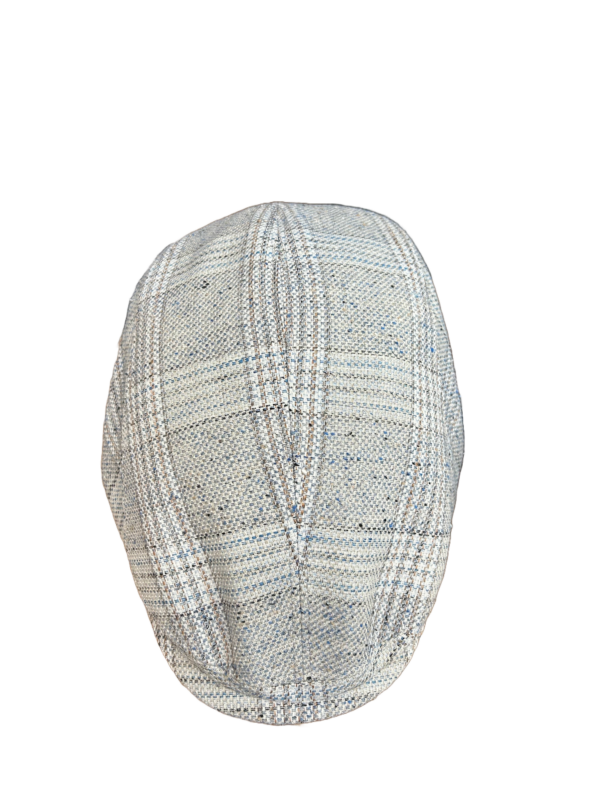 Top view of a beige and blue plaid linen flat cap with a textured weave and panel stitching.